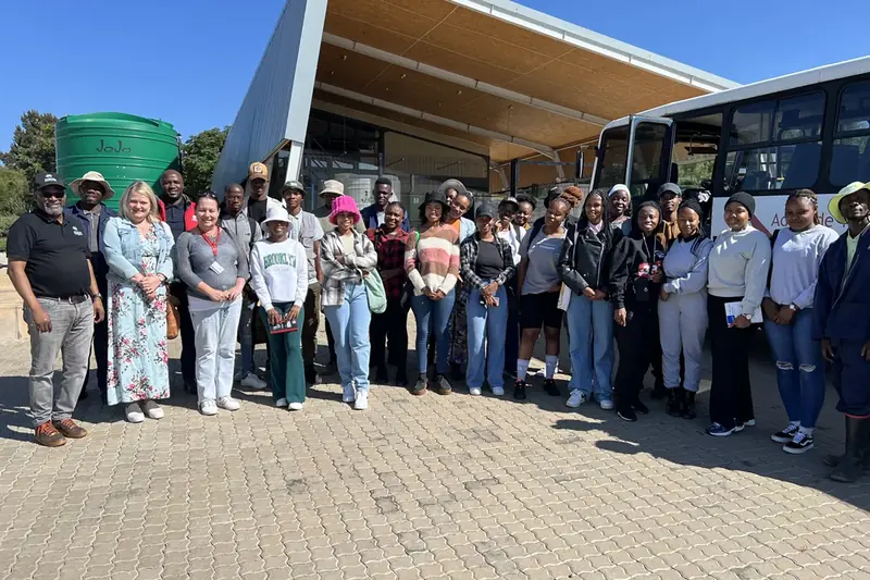 Programme participants and staff gathered outside a training centre