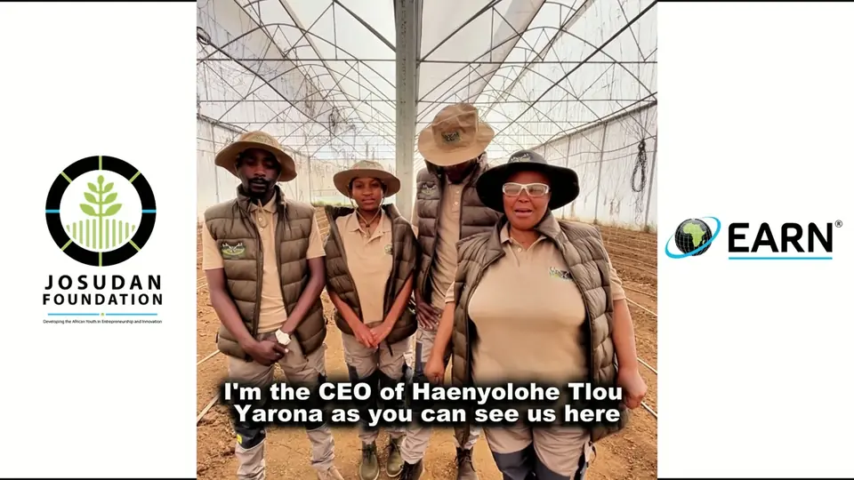 An agripreneur team standing in their tunnel, framed by the Josudan Foundation and EARN logos